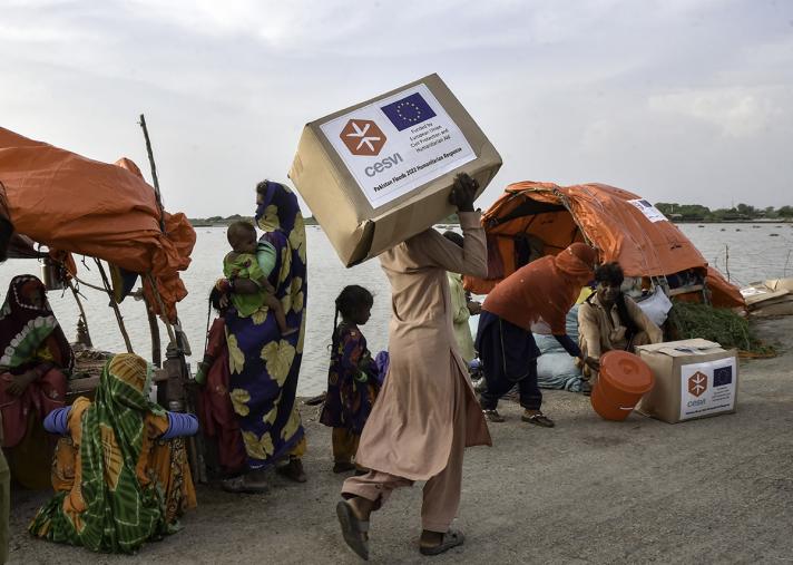 A man carries relief items